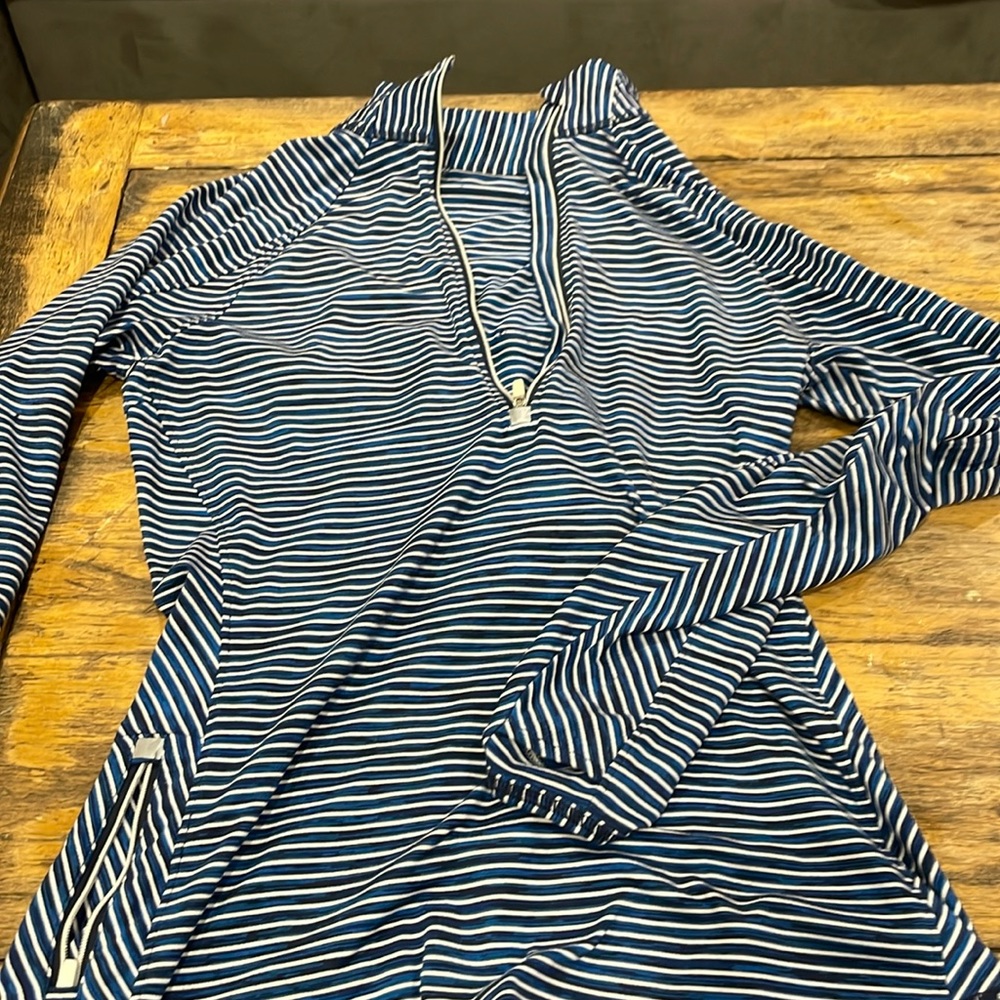 Nice Athleta top for doing or running. Half zip. Very comfortable. Excellent